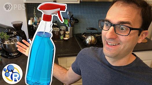 middle age man with black rimmed glasses in his kitchen staring at clip art spray bottle overlay